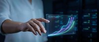 Professional businessman analyzing digital growth charts and data visualization on futuristic holographic display for business intelligence and analytics.