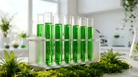 Green liquid samples in glass test tubes arranged on laboratory stand surrounded by moss and ferns in bright modern research facility for scientific analysis.