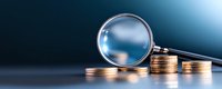 Magnifying glass examining stacked gold coins on dark background with blue gradient lighting, financial analysis and investment concept.
