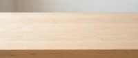 Wooden table top with light natural finish and dark wood edge, isolated on white background for design mockups and product presentations.