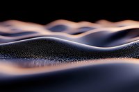 Abstract macro landscape with smooth rolling waves of dark material covered in tiny light particles, creating mysterious atmospheric mood in purple and blue tones.
