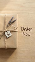 Kraft paper gift box tied with twine and dried lavender on wooden surface, order now text, eco-friendly packaging concept.