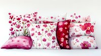 Decorative throw pillows with pink floral patterns arranged in row. Watercolor style cushions featuring cherry blossoms and wildflowers on white and burgundy backgrounds.