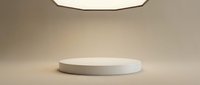 Empty white cylindrical podium on neutral beige background with soft overhead lighting, suitable for product display, mockups, and commercial presentations.