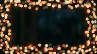 Festive bokeh lights frame a dark center space, creating a warm, glowing border with golden and colored light orbs. Use for holiday backgrounds, seasonal promotions, and celebration designs.