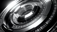Futuristic metallic spiral with binary code, glowing center, dark monochrome tone, symbolizing digital technology, data encryption, and cybersecurity concepts.