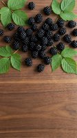 Fresh blackberries with green leaves arranged on rustic wooden surface, ideal for food and beverage marketing, recipe blogs, and organic product packaging designs.
