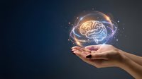 Human hands holding glowing brain with neural network connections and light effects on dark blue background for artificial intelligence concepts.