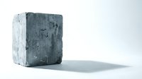 Weathered concrete block with rough textured surface casting shadow on white background, industrial construction material for architectural design projects.