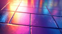 Vibrant neon lights reflecting on wet pavement tiles create dramatic urban nightlife atmosphere with pink and blue gradient colors in macro photography perspective.