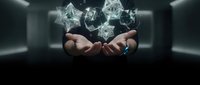 Businessman hands holding floating transparent geometric crystals in modern office space for technology and innovation concepts.
