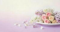 Elegant floral arrangement with pink roses and white flowers on soft gradient background for wedding invitations and romantic designs.