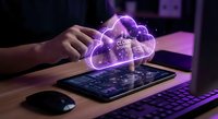 Businessman using tablet with glowing cloud computing hologram for data storage and digital transformation in modern office workspace.