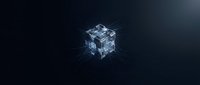 Glowing crystalline cube with digital light rays on dark background, representing technology, data processing, and innovation concepts.