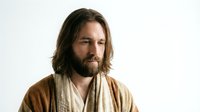 Middle-aged Caucasian man with long brown hair and full beard wearing traditional brown robe, spiritual leader or historical character portrait.