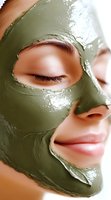 Close-up of young Asian woman with green clay mask on face during spa treatment, showing smooth skin texture and relaxed expression. For beauty and wellness content.