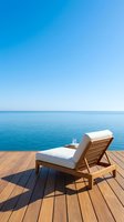 Wooden lounge chair with white cushion on deck overlooking calm blue ocean and clear sky, ideal for travel, vacation, and relaxation concepts.
