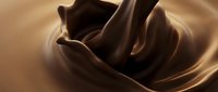 Smooth melted chocolate swirling in rich brown waves creating luxurious texture for culinary dessert and confectionery advertising applications.