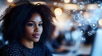 Young African American businesswoman with curly hair surrounded by floating digital icons and bokeh lights representing modern technology and connectivity.