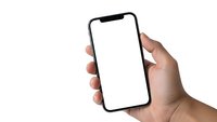 Hand holding modern smartphone with blank white screen isolated on white background for mobile app presentation and digital marketing mockup.