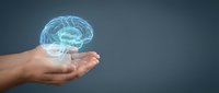 Human hands holding glowing digital brain hologram representing artificial intelligence, neuroscience, mental health and cognitive technology concepts.