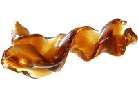 Flowing amber honey stream in spiral shape against white background, glossy golden syrup swirl with transparent effect and natural organic texture.