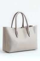 Elegant beige leather tote bag with dual handles isolated on white background, minimalist design for modern fashion and accessory marketing.