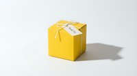 Yellow gift box tied with twine and a thank you tag, isolated on white background. Minimal packaging for celebrations and gratitude.