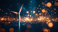 Majestic wind turbine against dark sky with glowing orange bokeh lights and magical sparkle effects creating atmospheric renewable energy scene.