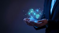 Businessman holding glowing digital network sphere with connected nodes and data points, representing technology, innovation, and global connectivity for business solutions.