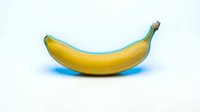 Ripe yellow banana with green stem isolated on white background with blue shadow, ready for food and nutrition design projects.