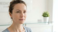 Professional Caucasian woman in modern kitchen interior looking confident and relaxed during morning routine at home for lifestyle content.