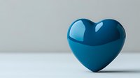 Glossy blue heart shape on light background with soft shadow and reflection, minimalist romantic symbol for love concepts and valentines designs.