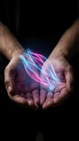 Male hands cupping glowing neon light trails in pink and blue colors against dark background representing energy, magic, technology and innovation concepts.