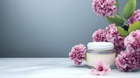Pink carnation flowers surrounding cosmetic cream jar on gray background, elegant skincare product presentation with fresh blooms and soft lighting for beauty industry.