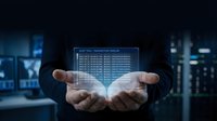 Businessman hands presenting holographic data analytics dashboard with financial charts and statistics in modern office environment.