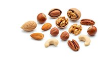 Mixed nuts collection with almonds walnuts pecans cashews hazelnuts on white background for healthy snacking cooking baking recipes nutrition concepts.