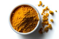 Ground turmeric powder in white ceramic bowl and scattered on white background, top view. Natural organic spice with bright orange color and healing properties.
