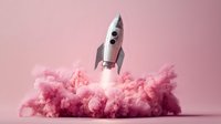 Silver rocket launching through pink cotton candy clouds on pastel pink background, symbolizing business startup or innovation concept.