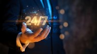 Businessman hand holding glowing 24/7 text with digital network connections and light effects for customer service and support concepts.