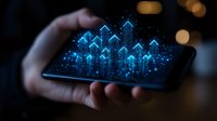 Glowing blue digital arrows rising from smartphone screen held in dark, showing financial growth concept with sparkles and bokeh background effects.