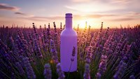 Purple glass bottle standing in blooming lavender field at golden sunset with warm light rays creating romantic atmosphere for aromatherapy and wellness products.