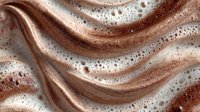 Luxurious rose gold metallic fabric with flowing waves and sparkling sequins creates elegant texture for fashion and celebration designs.