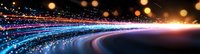 Glowing curved light trails with bokeh effect against dark background create magical atmosphere, abstract motion blur streaks in blue, purple and red colors.