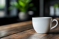 White ceramic coffee cup on rustic wooden table with natural morning light and blurred background, minimalist composition for cafe and lifestyle designs.