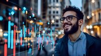 Young Hispanic businessman with glasses smiling while analyzing financial data charts and graphs on digital display in modern city office environment at night.