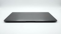 Sleek closed laptop with brushed metal lid on white background, showcasing modern portable computer design for tech and business concepts.