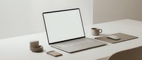 Modern minimalist workspace with open laptop displaying blank white screen on clean desk setup for productivity and remote work presentations.