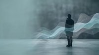 Man in dark jacket standing in urban environment with abstract flowing light waves, representing innovation, technology, and digital transformation concepts.