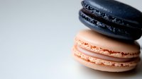 Colorful French macarons with smooth shells and creamy filling on white background, sweet dessert pastry for bakery menu and culinary photography.